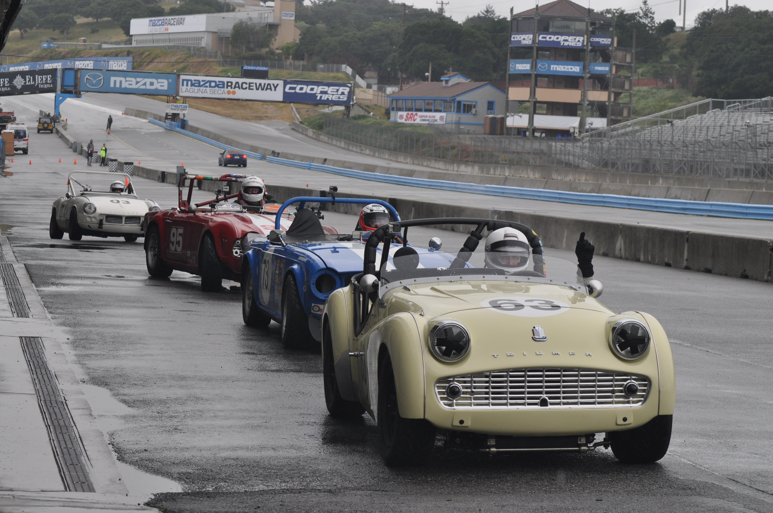Sunday morning , the grid is starting to line up on the grid to go out for qualifying in the rain. I’m the second car in line.