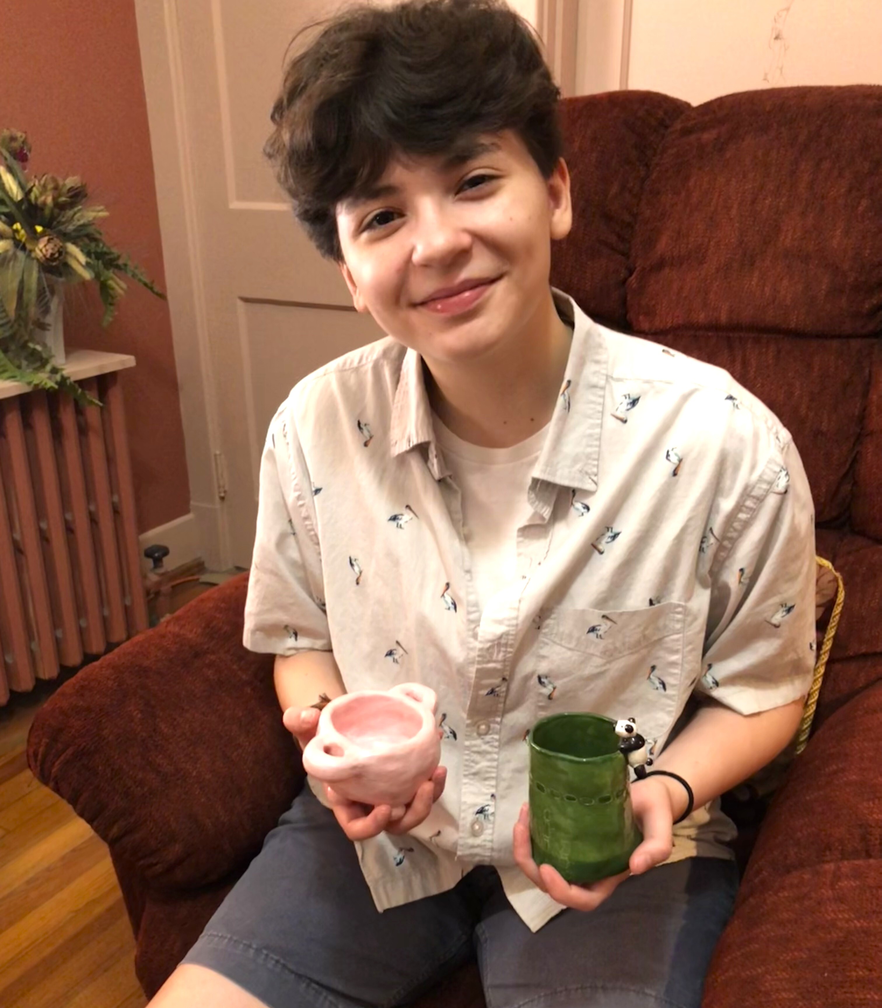 Elliott with his panda mug and udder pot.