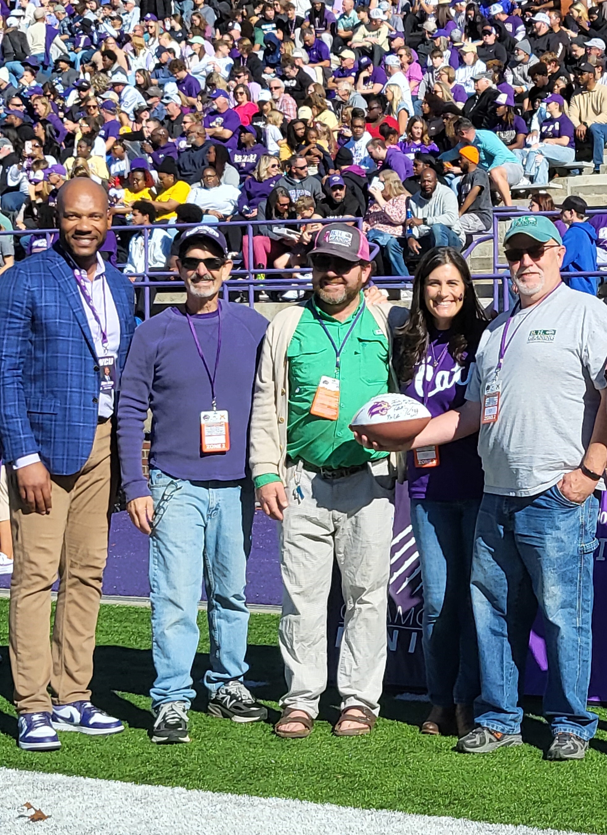 B.H. Graning Landscapes sponsors one home WCU football game annually. All employees are invited to attend the company-sponsored tailgate festivities and game. Employees were honored on the field during pregame (Keith Pannell and Tyler Applegate).
