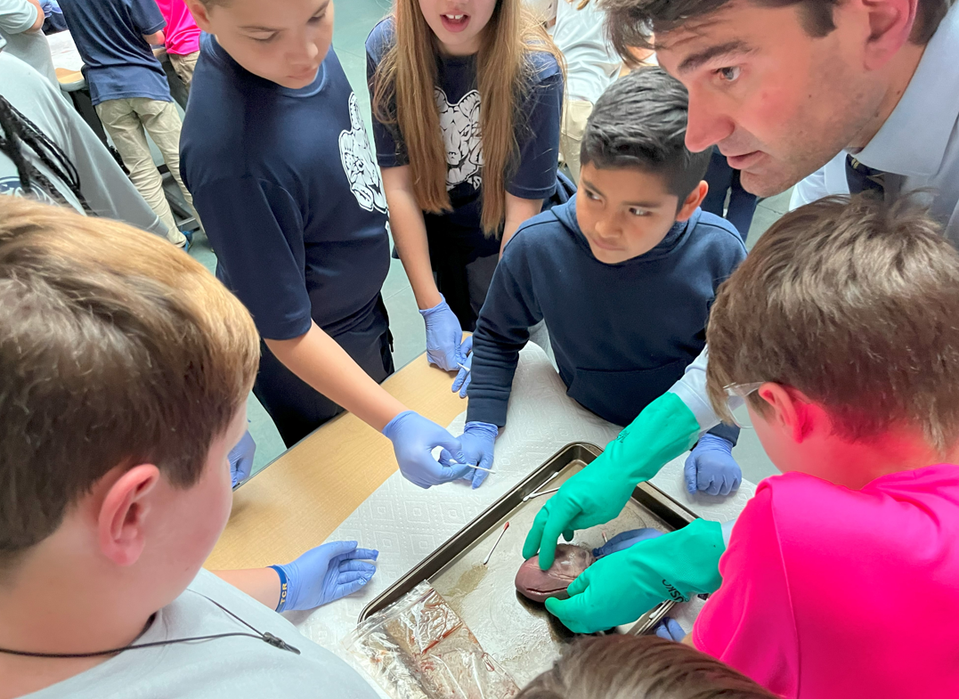 Dr. John Rhyner showed a heart to students at Valley Springs Middle School.