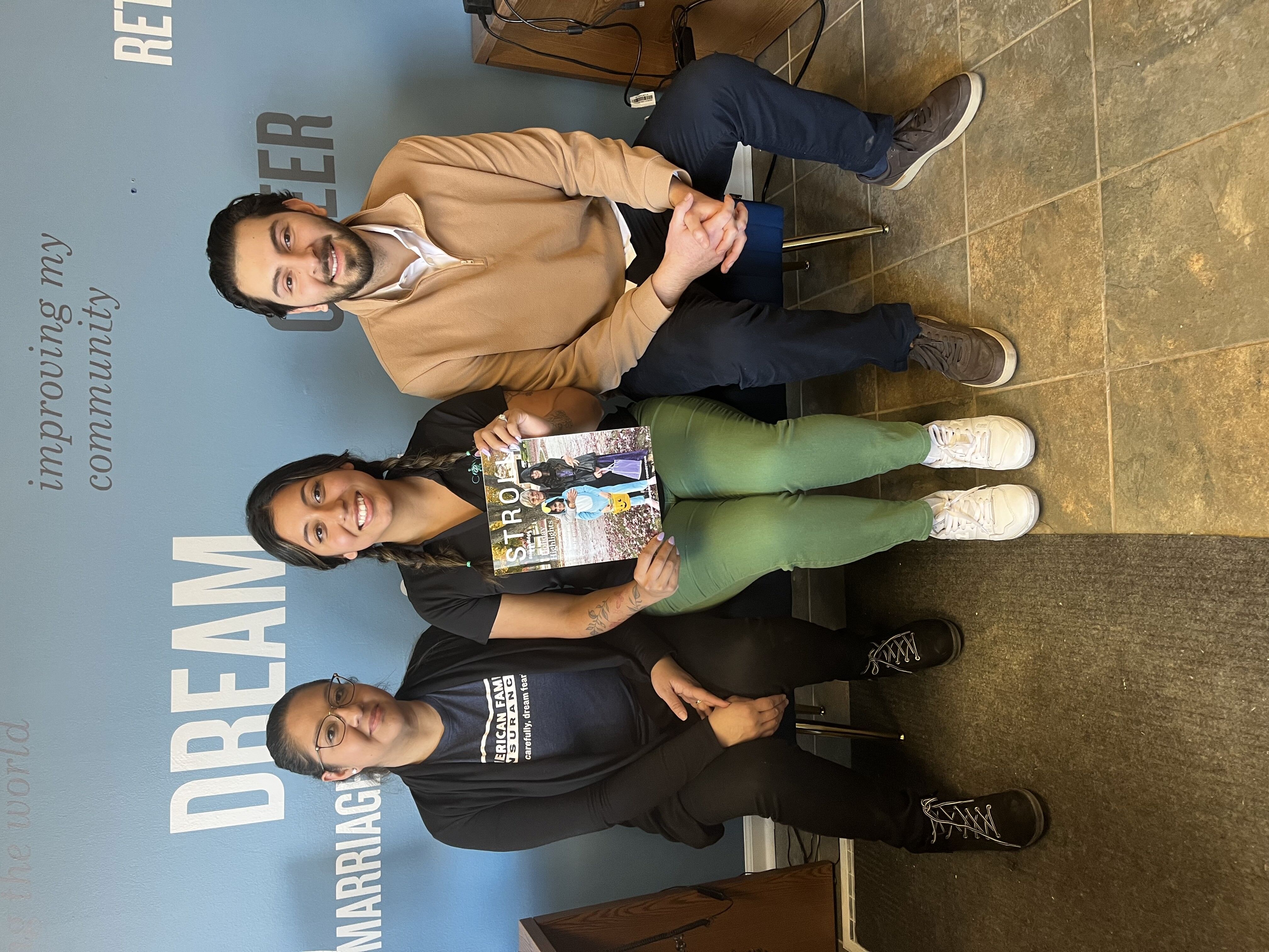 Maritza with her agency team, Yuliana, and her brother, Gustavo.