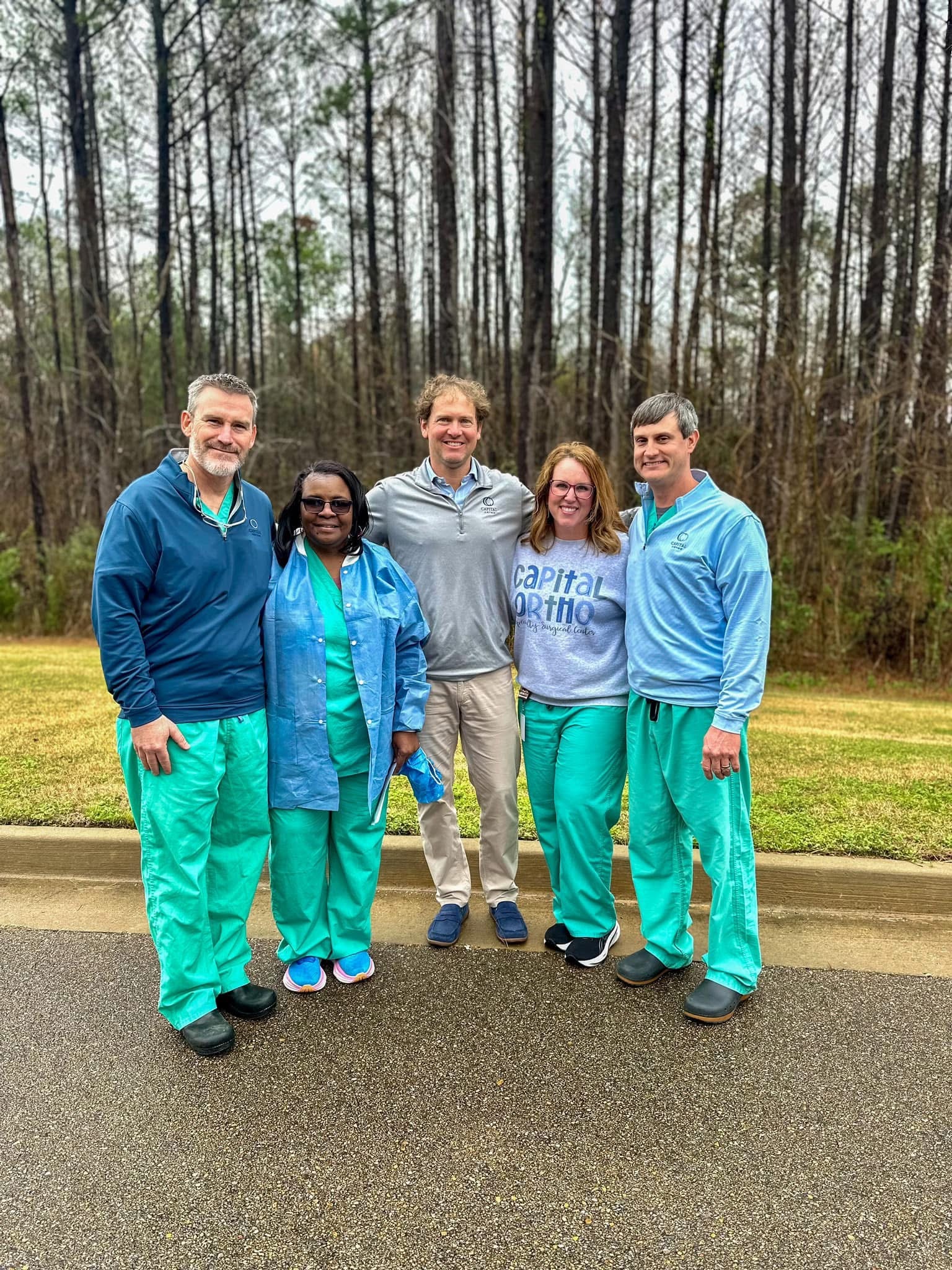 Dr. Chris Kneip, Kathy Brown (Sterile Processing Tech), Dr. Bradley Kellum, Lea Anna Burnside (Surgery Center Director), and Dr. Andy Brien at a recent office event