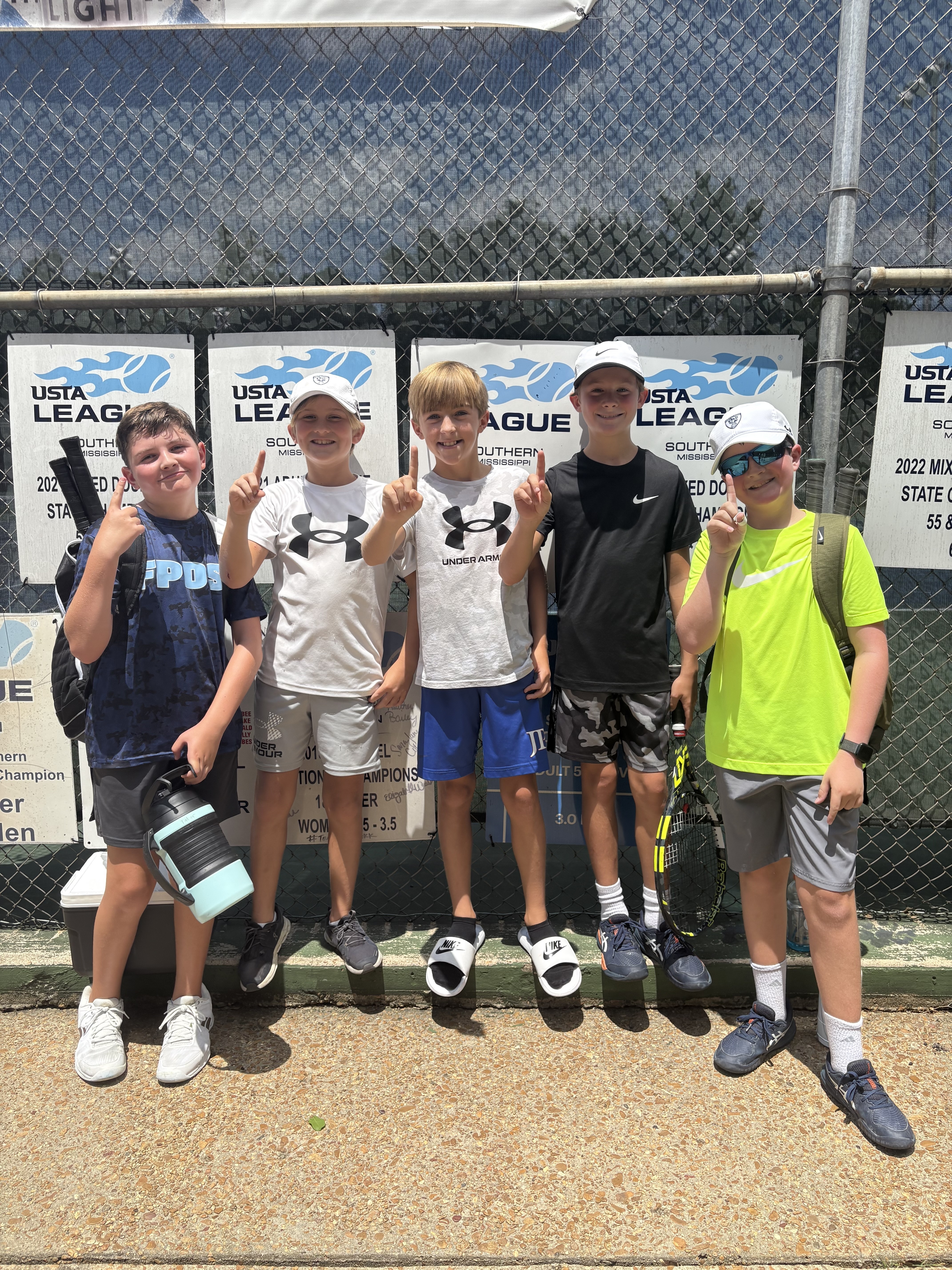 River Hills 12 and under co ed team won the Junior Tennis State Championship! Pictured left to right: Luke Tabor, Miller Stuckey, Win Pleasant (resident), Skip Hopkins (resident), and Turner Bailey. Way to go boys!