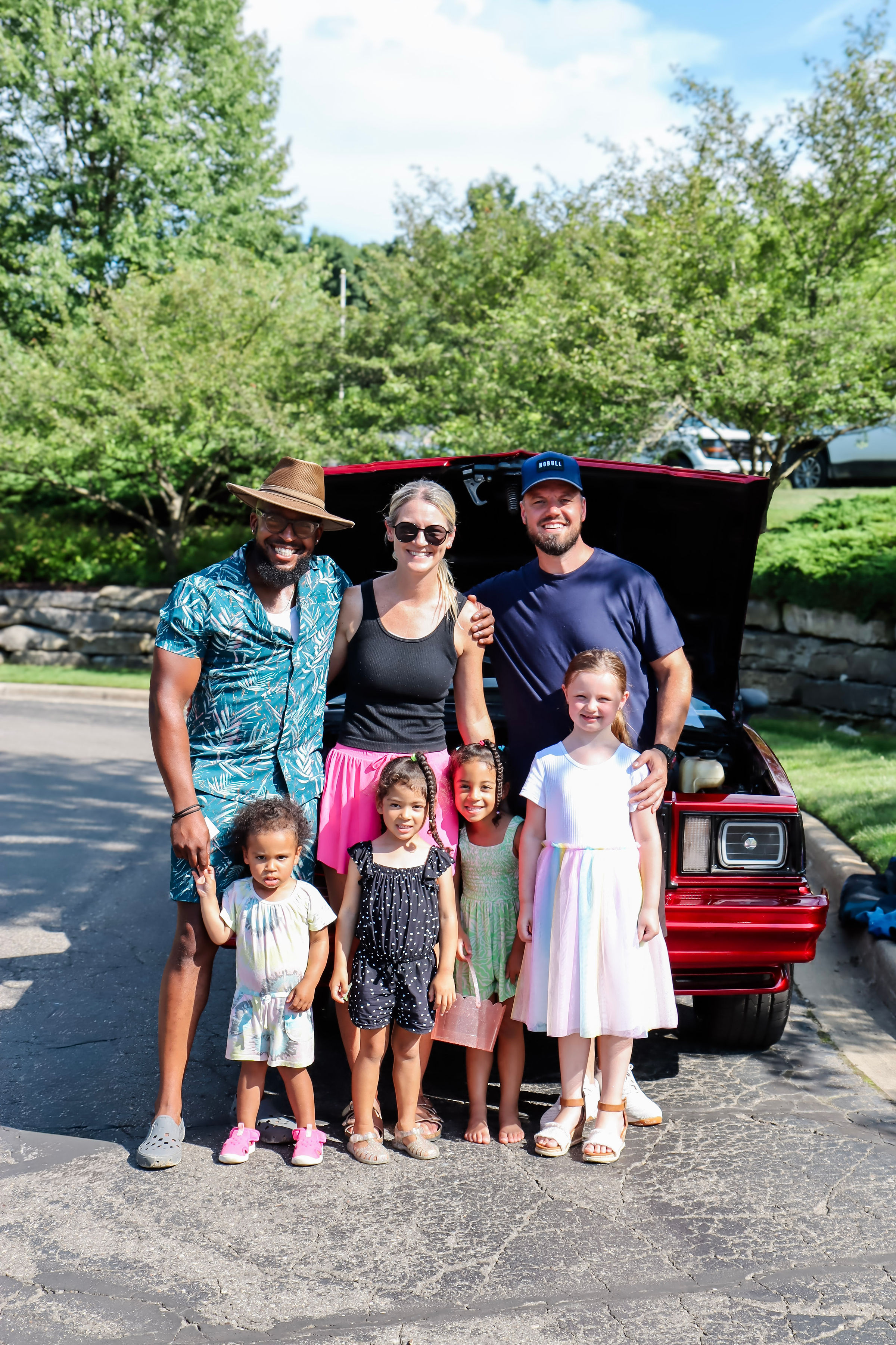 Our neighborhood mailman, Antuan Moore, proudly showing his 1979 Chevrolet Malibu with his family.