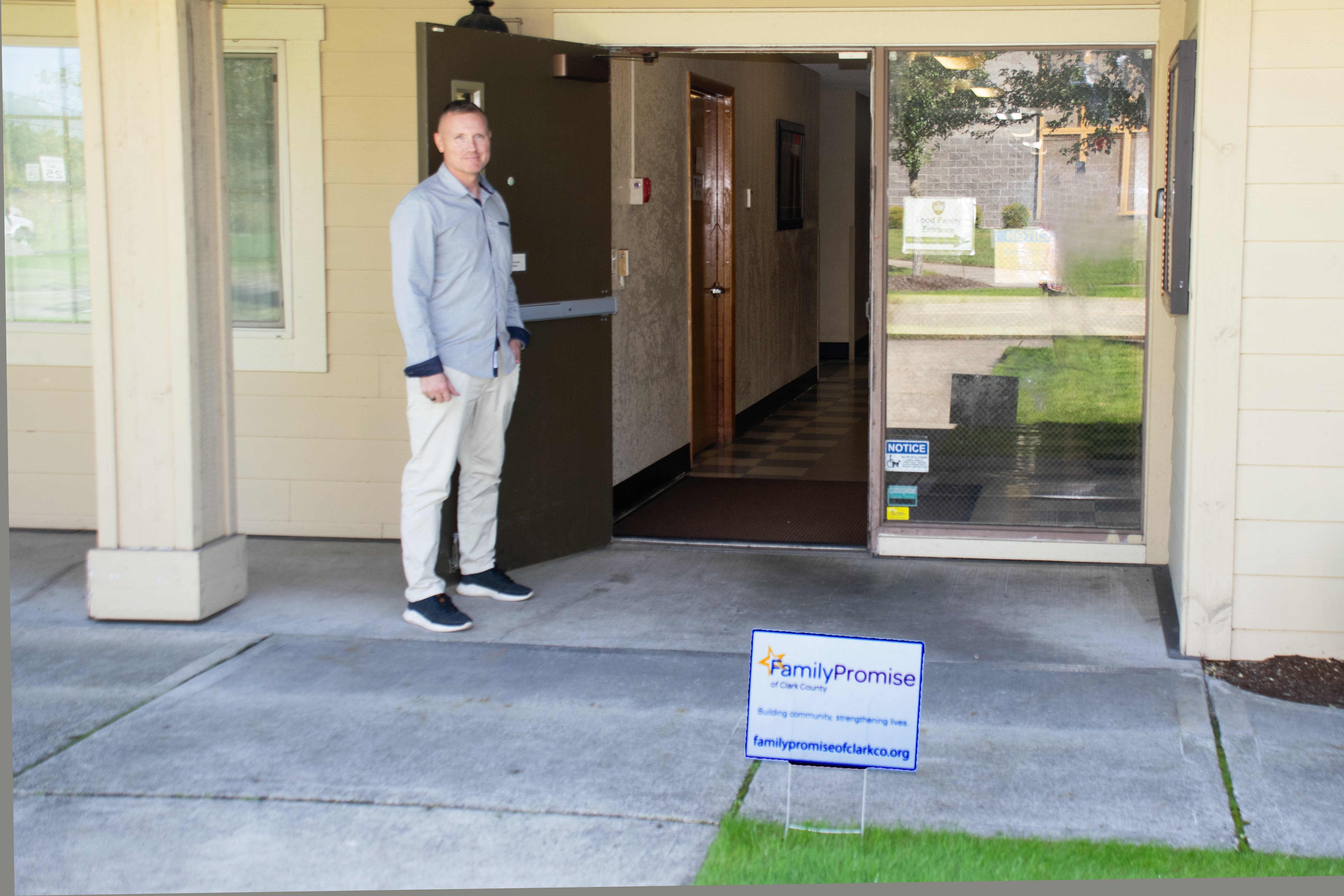 Shane at the front door to the Family Promise office in Meadow Glade