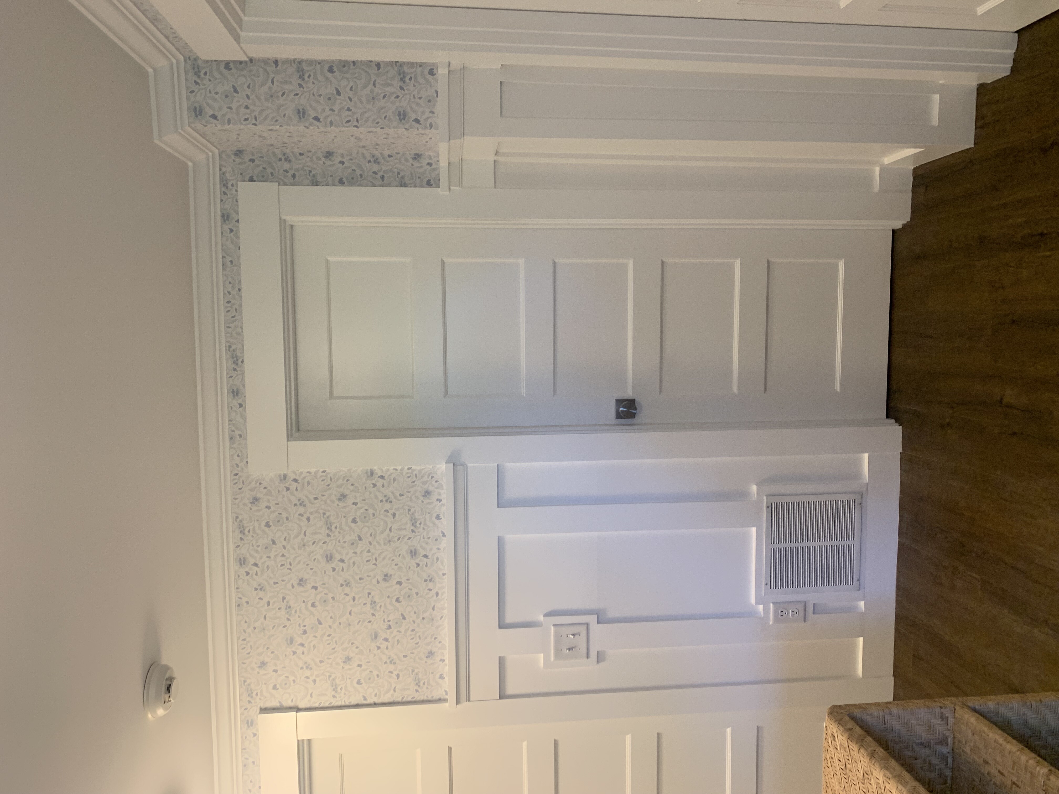Board and batten wall covering, all new 5-panel shaker-style doors, door casings and new crown molding throughout. Wallpaper by Peter Burnetter