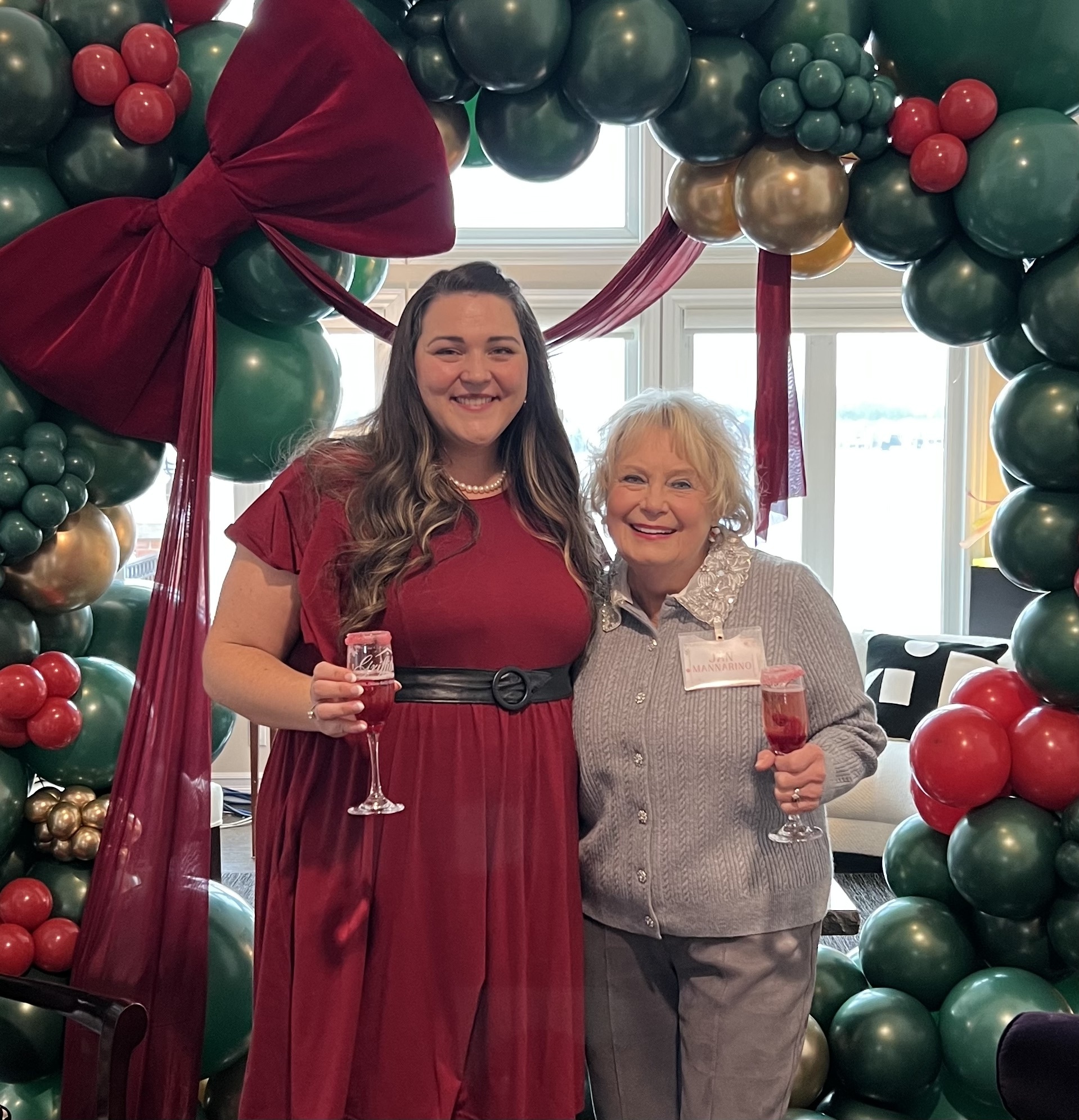 Champagne cheers with Publisher Jenni Eifler and Jan Mannarino, surrounded by Starrstruck’s festive balloon magic.