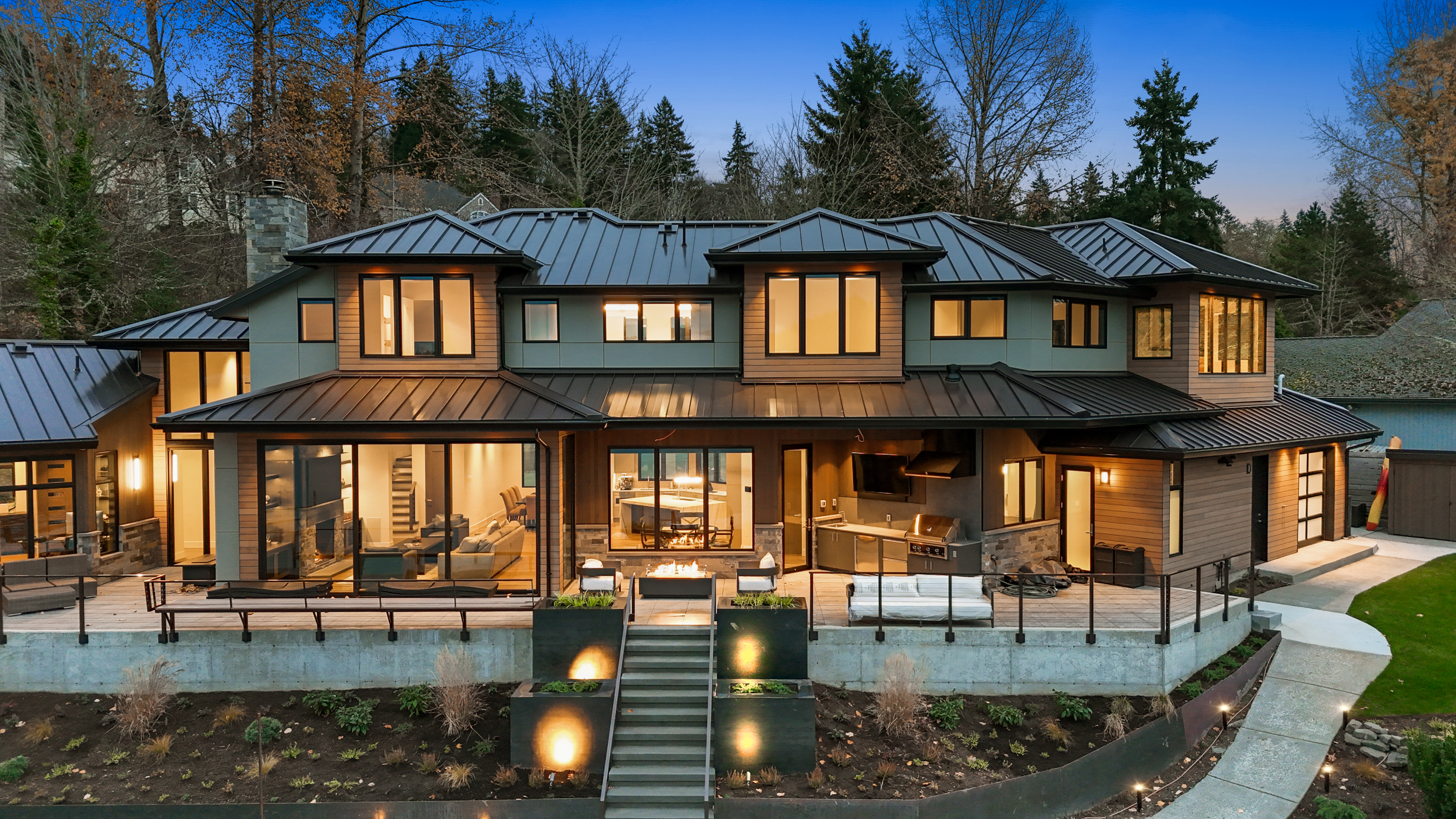 The architectural design and lighting scheme create a strong atmosphere and visual appeal for an evening view.