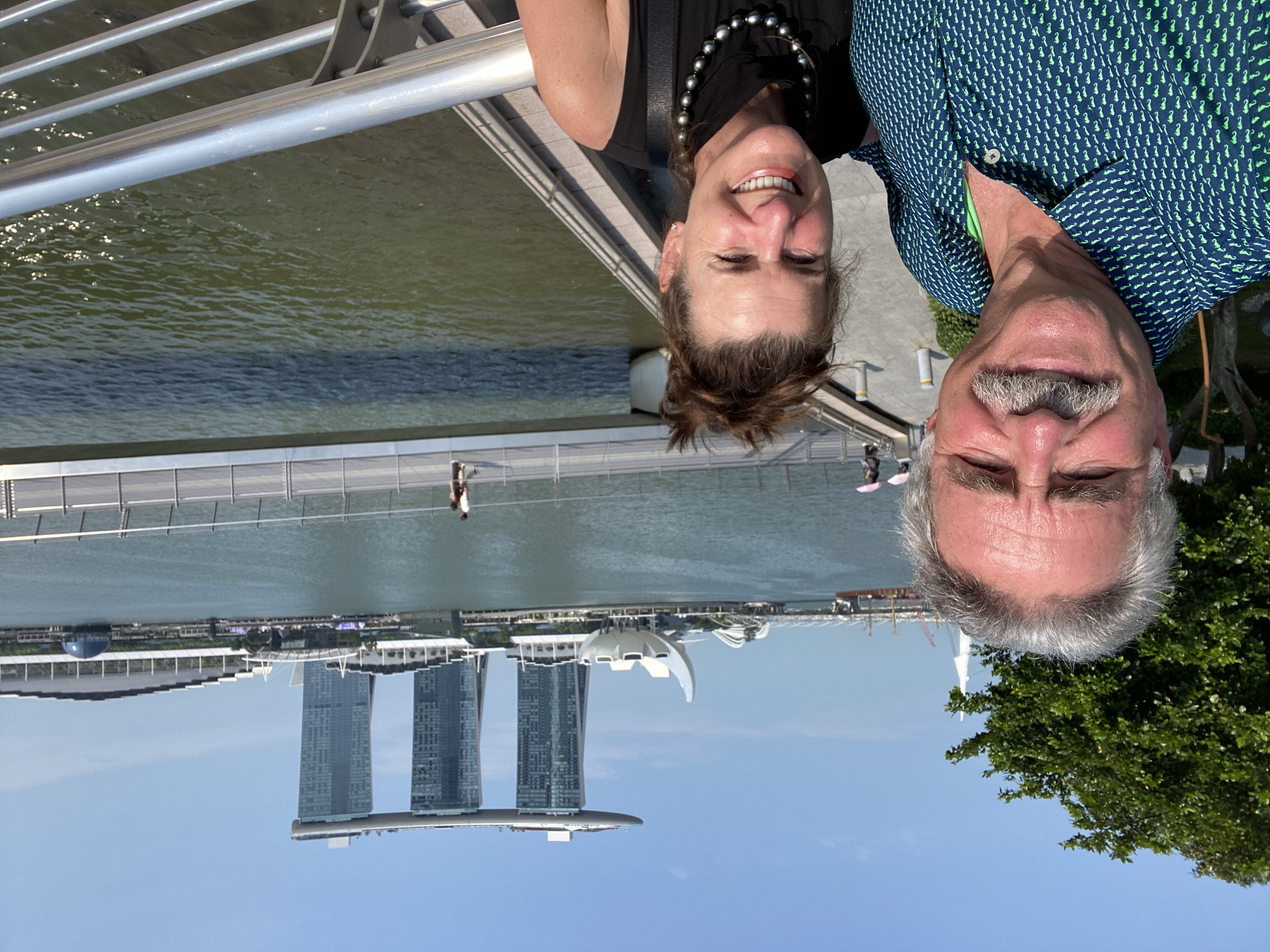 Michael and Maryann along the waterfront in Singapore, with the iconic Marina Bay Sands hotel in the background.