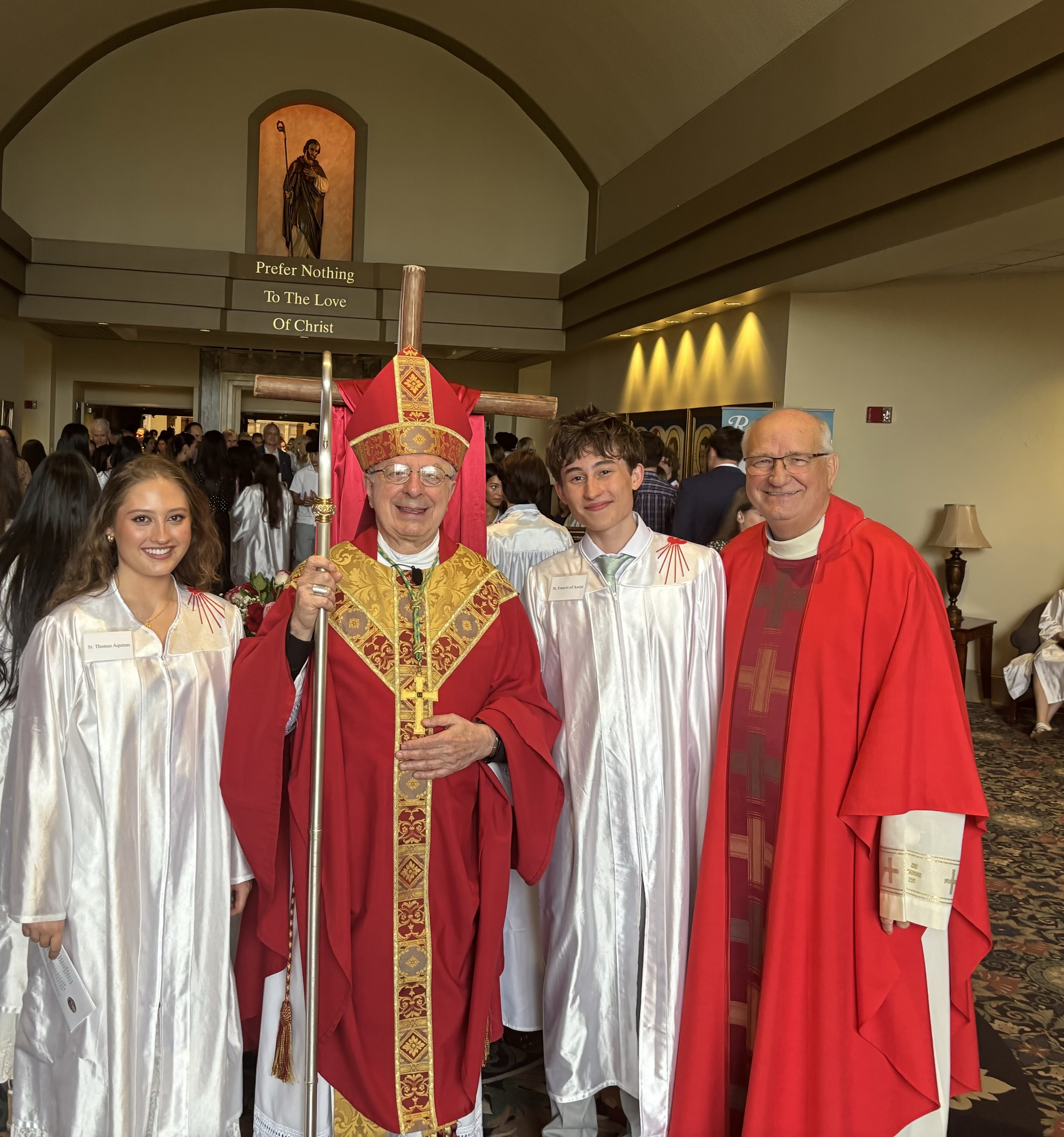 Allie and Hudson Gasper with the Bishop and their Priest Father Paul Flood.