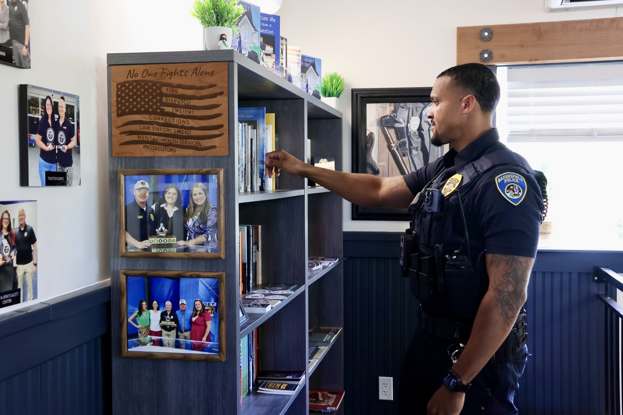 Officer I. Nuriddin browses the Wellness Center’s library, which offers resources focused on mental, physical, and spiritual well-being.