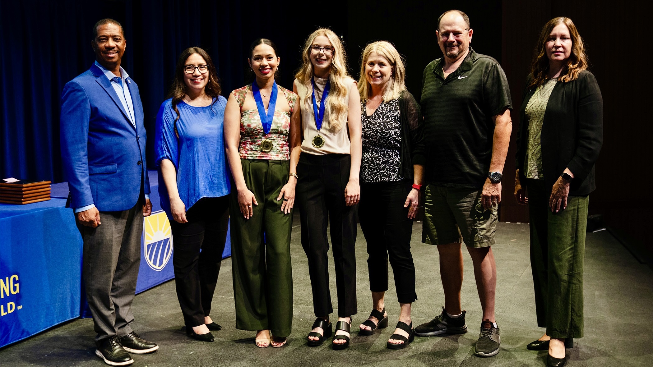 Winners, Alexandra and Kelbi with President Vernon B. Harper Jr. and Provost and Vice President for Academic Affairs Deborah Thien … and their own proud parents.