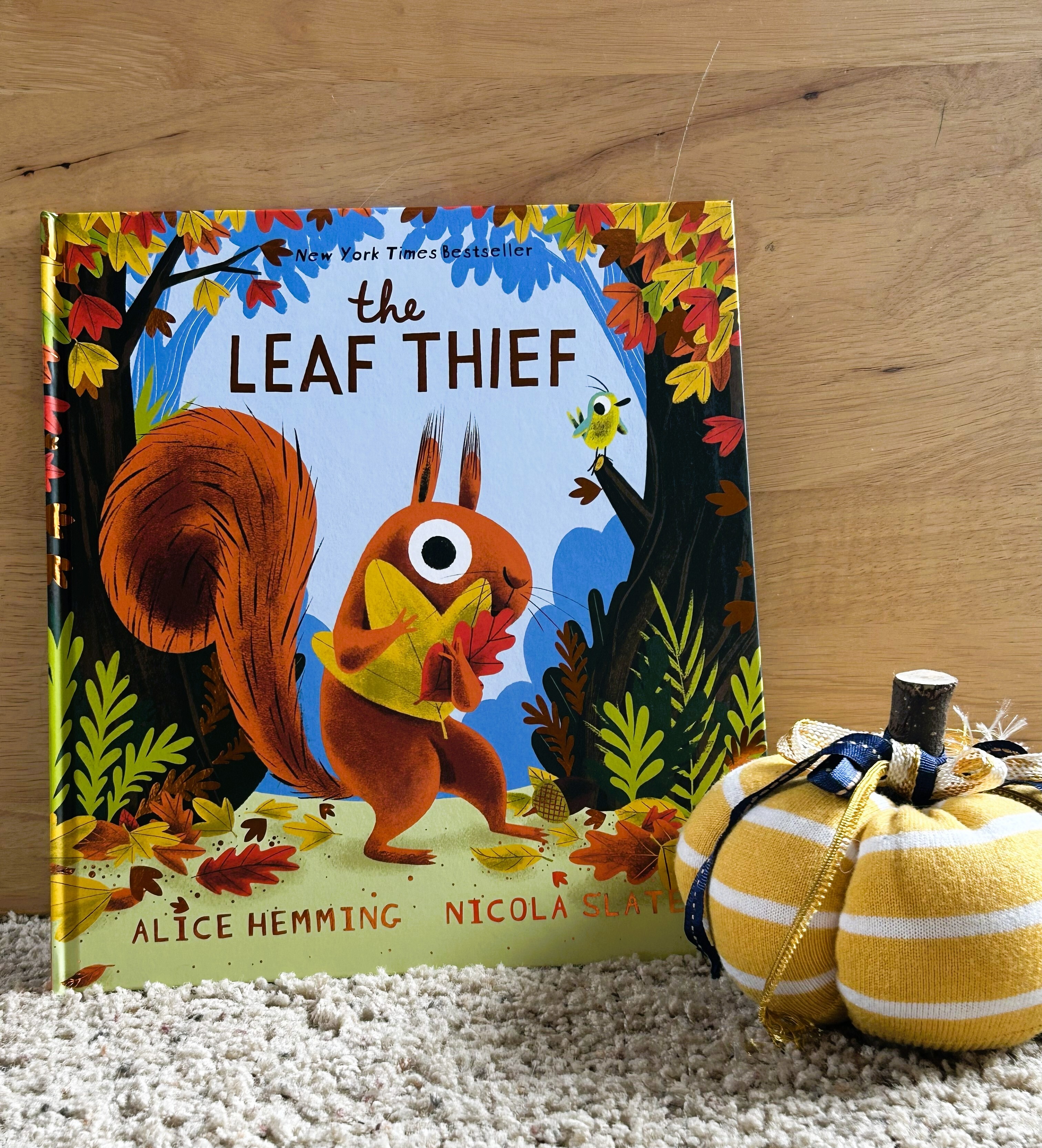 The Leaf Thief by Alice Hemming, illustrated by Nicola Slater, is a whimsical autumn story that blends humor, beautiful illustrations, and gentle lessons about the changing seasons, making it a perfect fall read for the whole family.