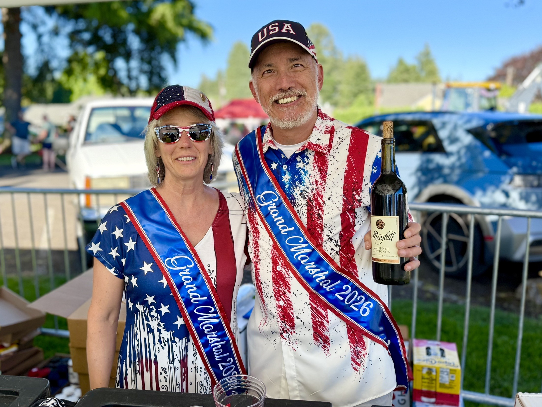 Maureen and Chris pouring beer and wine at the July 3rd Street dance
