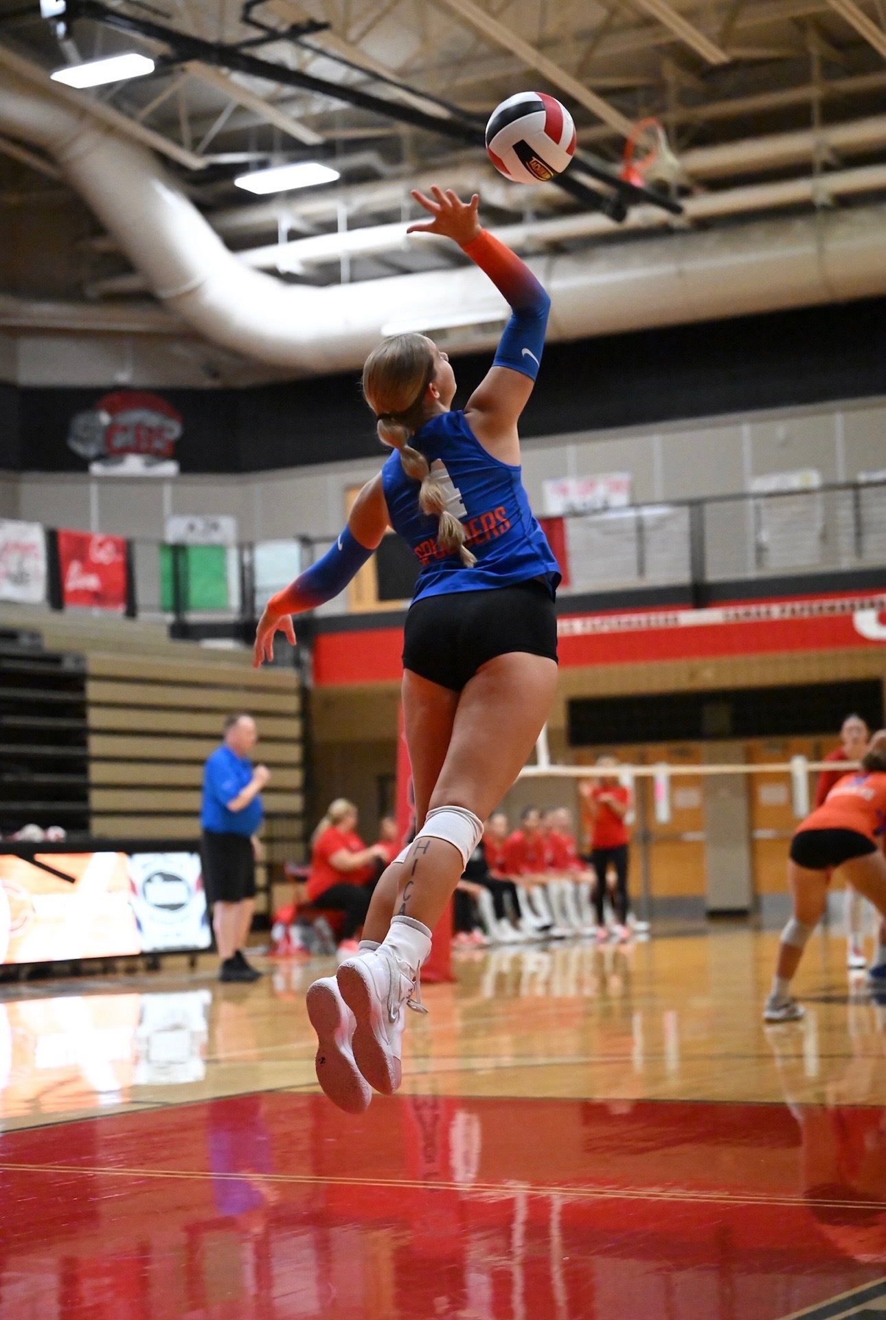 Paige Hanes serves at a Ridgefield High School volleyball game vs. Camas High School.