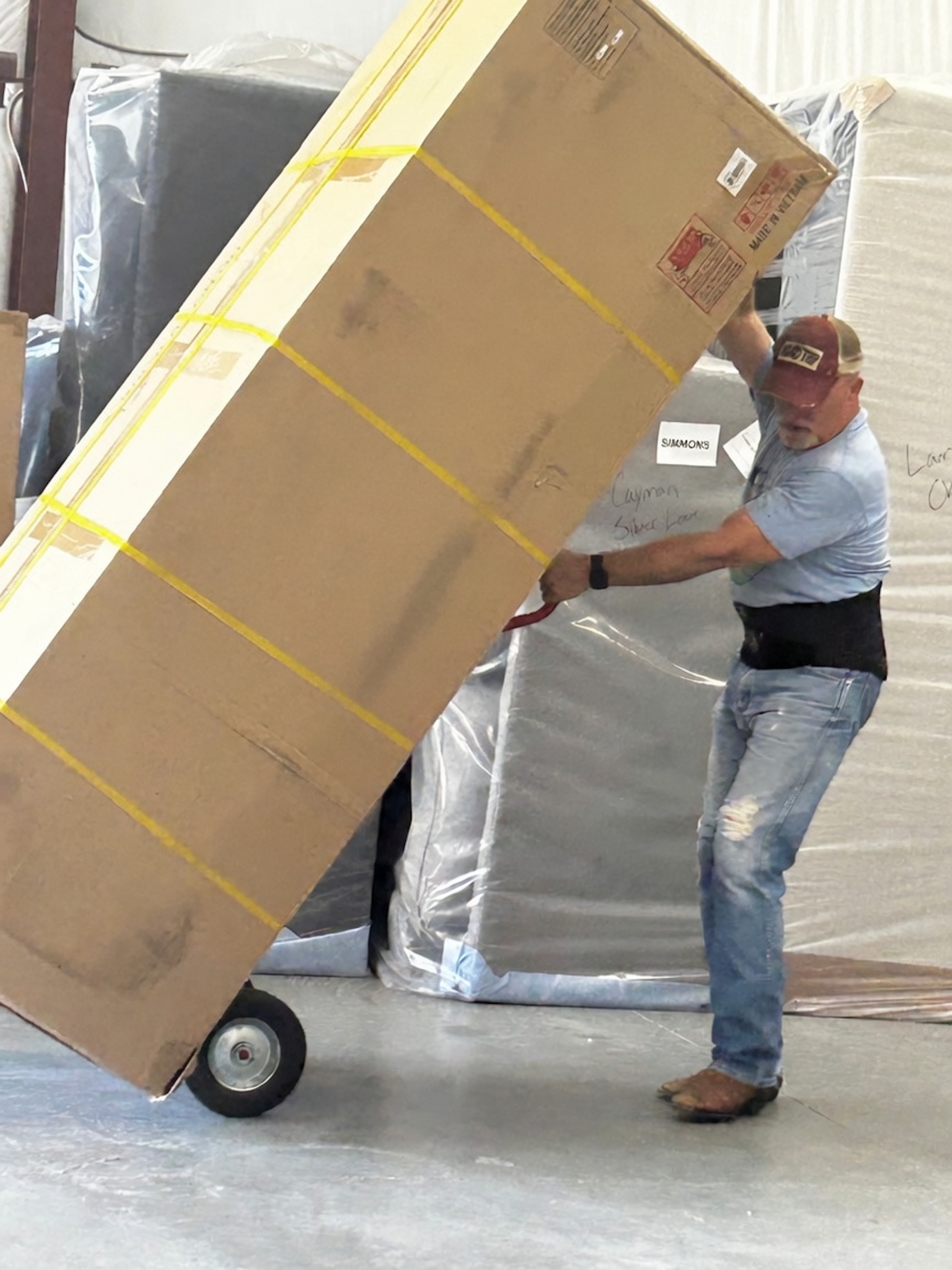 Todd Keller (In this family business, everyone pitches in) lending a hand with a furniture delivery!