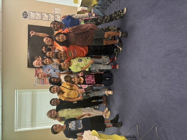 Ansley Park resident John Fenton, pictured with fellow Agape tutors and students, has volunteered with the organization for 15 years