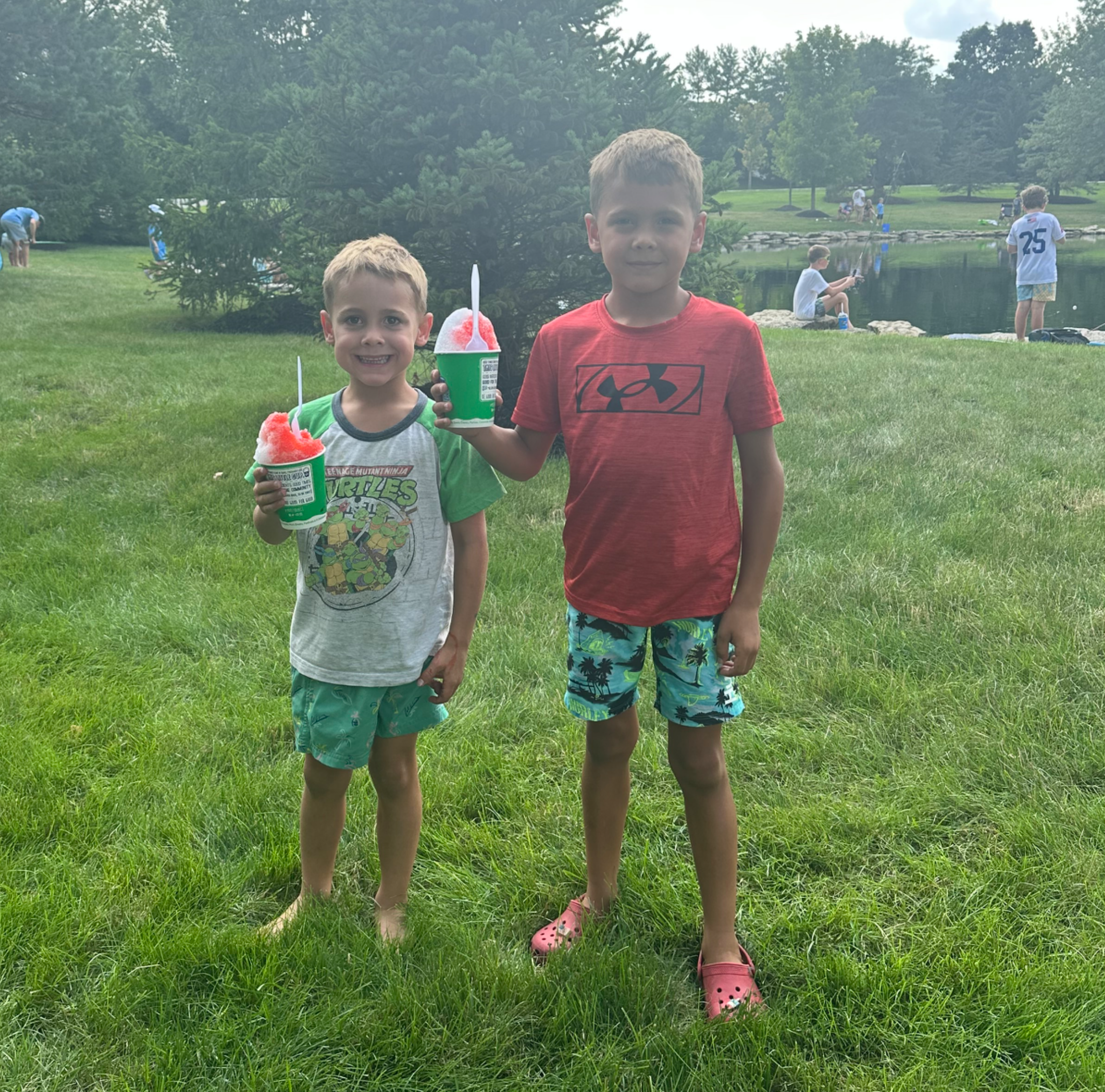 Isaac and Henry enjoy the Kona Ice.