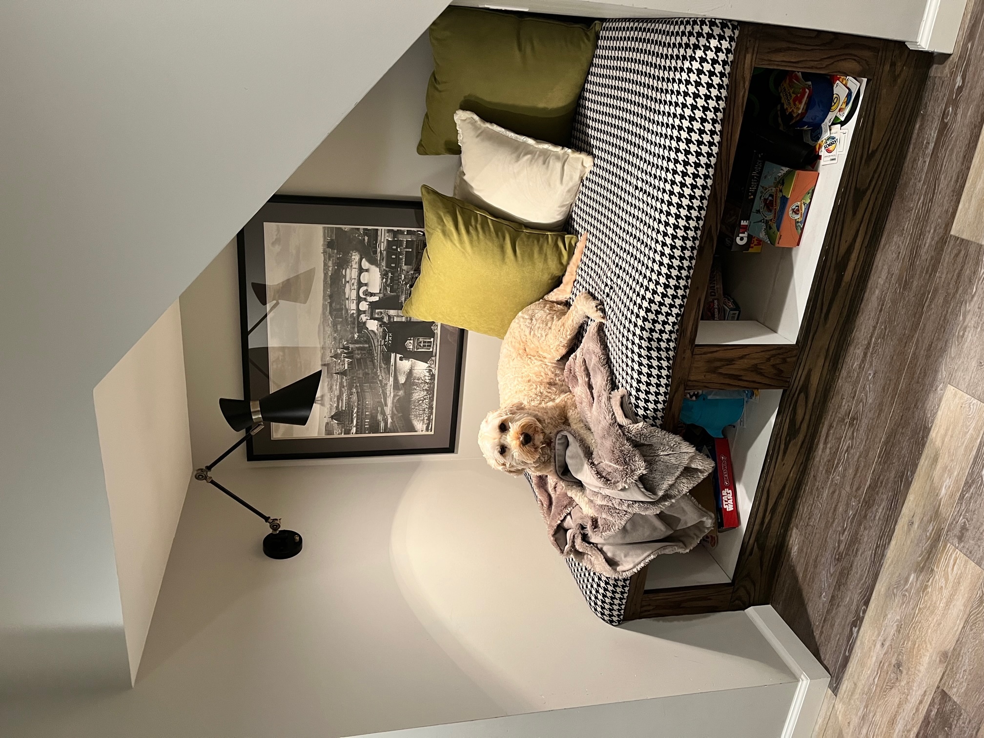 Reading nook under the steps — or maybe just an oversized dog bed