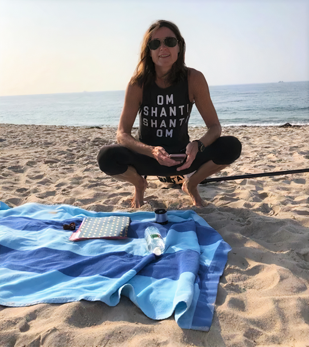 Karen on the Inn Beach in Weekapaug, ready to lead her yoga class